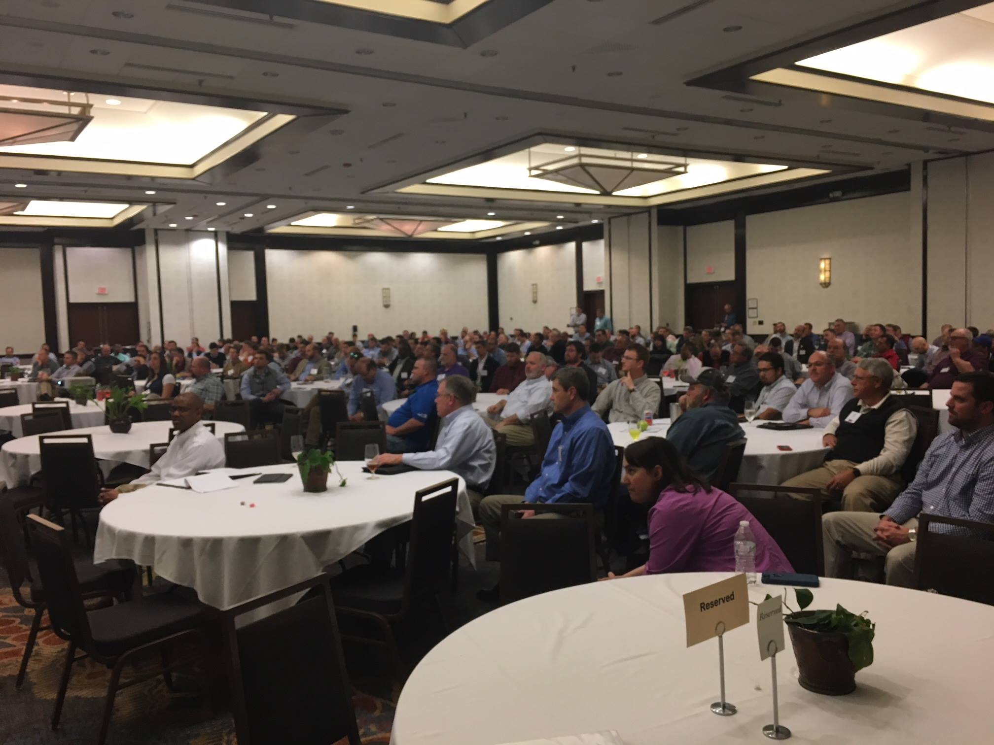 A crowd in Raleigh listens to Jim Trogdon Speak