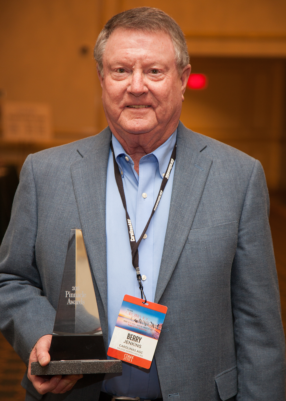 Berry Jenkins holding Pinnacle Award