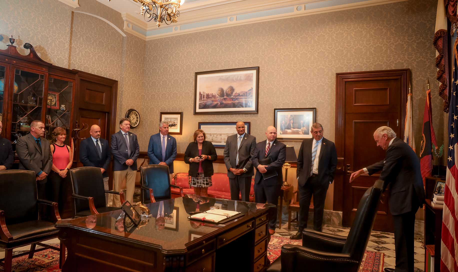 Governor McMaster talks with CAGC staff, members and officials in his office before signing the bill