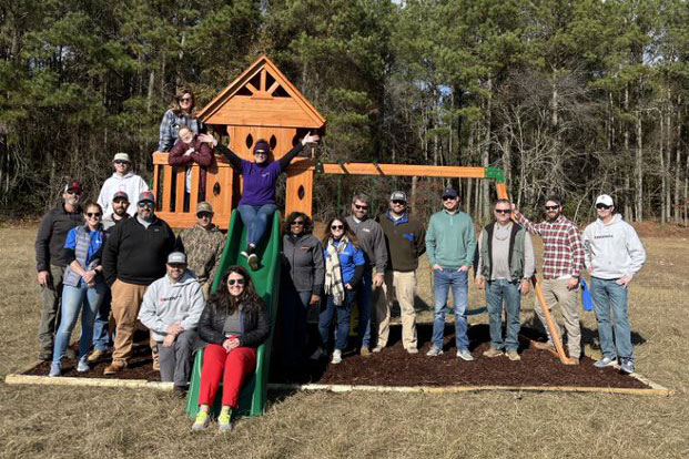 Barnhill Employees Around Swing set